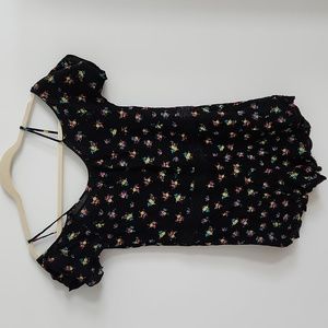 Cold shoulder short sleeve floral romper. Size XS.